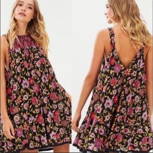 New Free People floral smocked mini dress Size M. Deep V back and smocking front